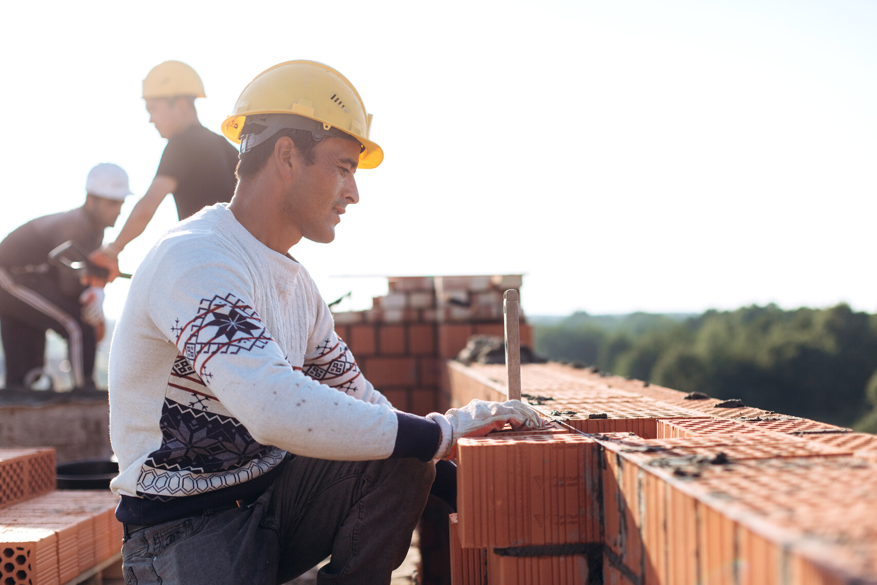 Brick Workers at Construction Site 